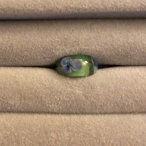 Trollbead - Green glass with amber purple flower